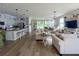 Spacious open-concept living room and kitchen with hardwood floors at 3567 74Th Avenue E Cir, Sarasota, FL 34243