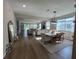 Open floor plan with living, dining, and kitchen areas, perfect for entertaining at 3567 74Th Avenue E Cir, Sarasota, FL 34243