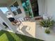 Covered patio with outdoor seating, offering a relaxed space with views of the backyard at 3567 74Th Avenue E Cir, Sarasota, FL 34243