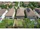 Aerial view from backyard with green space and fence for privacy in the neighborhood at 12990 Burns Dr, Odessa, FL 33556