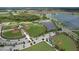 Aerial view of community baseball fields, surrounding lakes, and lush landscaping at 12990 Burns Dr, Odessa, FL 33556