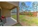 Cozy backyard featuring an extended patio and a well-maintained lawn with some landscaping at 12990 Burns Dr, Odessa, FL 33556