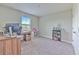This functional bedroom boasts a desk, shelving, and ample natural light, ideal for work or study at 12990 Burns Dr, Odessa, FL 33556