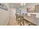 Dining room with spacious wood table and open access to foyer and living areas at 12990 Burns Dr, Odessa, FL 33556