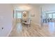 Dining room showcasing tile floors, a modern chandelier, and direct access to kitchen at 12990 Burns Dr, Odessa, FL 33556