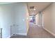 Upstairs hallway with neutral carpeting, recessed lighting, and view into a playroom at the end at 12990 Burns Dr, Odessa, FL 33556