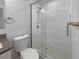 Modern bathroom featuring a glass-enclosed shower with white subway tile at 4506 Shadberry Dr, Tampa, FL 33624