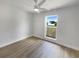 Bright bedroom with neutral tones, ceiling fan, and a large window at 4506 Shadberry Dr, Tampa, FL 33624