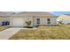 Single-story home with an attached garage and manicured front yard at 4506 Shadberry Dr, Tampa, FL 33624