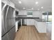 Contemporary kitchen with stainless steel appliances, gray countertops, and ample cabinet space at 4506 Shadberry Dr, Tampa, FL 33624