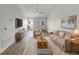 Bright living room with stylish furniture, area rug, and large TV for relaxation at 4506 Shadberry Dr, Tampa, FL 33624