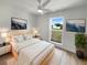 Calm main bedroom with neutral tones, stylish decor, and a large window at 4506 Shadberry Dr, Tampa, FL 33624