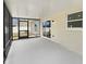 Enclosed patio with sliding door to the fenced backyard allows light to fill the space at 4506 Shadberry Dr, Tampa, FL 33624