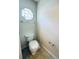Well-lit half bathroom with modern fixtures, including a decorative window and neutral wall colors at 4605 Ashburn Square Dr, Tampa, FL 33610