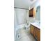 This full bathroom features a vanity, toilet, and a shower-tub combination with tile surround at 4605 Ashburn Square Dr, Tampa, FL 33610