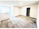 This bedroom includes neutral carpeting, light walls, and a doorway to an en-suite bathroom at 4605 Ashburn Square Dr, Tampa, FL 33610