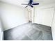 Bright bedroom featuring plush carpet, a ceiling fan, and a closet with bi-fold doors at 4605 Ashburn Square Dr, Tampa, FL 33610