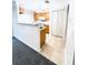 View of the kitchen that shows wooden cabinets, an open layout, and tiled floors. It shows great storage space at 4605 Ashburn Square Dr, Tampa, FL 33610