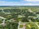 Aerial view of a single Gathering home in a community with lots of green trees at 4798 Jody Ave, North Port, FL 34288
