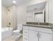 Clean bathroom featuring a shower-tub combo, granite vanity, and modern fixtures at 4798 Jody Ave, North Port, FL 34288