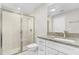 Modern bathroom featuring a glass-enclosed shower, granite vanity, and contemporary fixtures at 4798 Jody Ave, North Port, FL 34288
