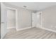 Spacious bedroom with wood-look floors, neutral paint and an open closet at 4798 Jody Ave, North Port, FL 34288