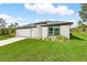 Beautiful one-story home with a lush lawn and attached two-car garage at 4798 Jody Ave, North Port, FL 34288