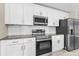 Close up view of the kitchen with stainless steel appliances and white subway tile backsplash at 4798 Jody Ave, North Port, FL 34288