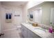 Bathroom featuring double sinks, granite countertops, and a large mirror at 12105 Everglades Kite Rd, Weeki Wachee, FL 34614