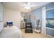 Cozy bedroom with blue accent wall, comfortable chair, and natural light at 12105 Everglades Kite Rd, Weeki Wachee, FL 34614