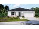 Beautiful single-story home with a stone accent wall and well manicured front lawn at 18246 Macassar Rd, Brooksville, FL 34614
