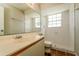 Bright bathroom with shower, toilet, large mirror and single sink vanity at 3703 43Rd W Ave, Bradenton, FL 34205