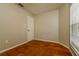 Bedroom with a window and closet and orange tiled floors at 3703 43Rd W Ave, Bradenton, FL 34205
