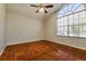 Bedroom featuring tile flooring and ample natural light from a large arched window at 3703 43Rd W Ave, Bradenton, FL 34205