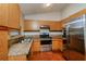 Well-lit kitchen featuring granite countertops and stainless steel appliances at 3703 43Rd W Ave, Bradenton, FL 34205