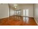 Bright living room featuring tile flooring, bay window, and access to the backyard at 3703 43Rd W Ave, Bradenton, FL 34205