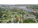 Aerial view of a neighborhood featuring a home with a red marker, close to a scenic waterway at 7635 Pier Rd, Port Richey, FL 34668