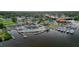 Aerial view of a restaurant with outdoor seating on the water with boats docked around it at 7635 Pier Rd, Port Richey, FL 34668