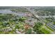 Aerial view of a neighborhood featuring a home with a red marker, close to a scenic waterway at 7635 Pier Rd, Port Richey, FL 34668