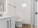 Clean renovated bathroom with sleek vanity, illuminated mirror, and walk-in shower at 7635 Pier Rd, Port Richey, FL 34668