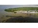 Beautiful beachside property featuring calm, clear waters and lush greenery, ideal for nature lovers at 7635 Pier Rd, Port Richey, FL 34668