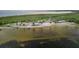 Scenic beach view with picnic pavilions and palm trees, perfect for a relaxing day by the water at 7635 Pier Rd, Port Richey, FL 34668
