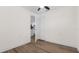 Bright room features modern flooring, white walls, and a closet with double doors at 7635 Pier Rd, Port Richey, FL 34668