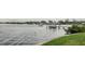 Scenic view of a calm river with a boat dock and lush green waterfront at 7635 Pier Rd, Port Richey, FL 34668