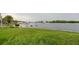 Picturesque waterfront view with lush green lawn, perfect for enjoying peaceful scenery and outdoor activities at 7635 Pier Rd, Port Richey, FL 34668