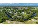 Aerial view of the property, surrounded by water, and showing the layout of the land at 5700 Oakview Ln, Punta Gorda, FL 33950