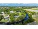 Aerial view of the property, surrounded by water, and showing the layout of the land at 5700 Oakview Ln, Punta Gorda, FL 33950