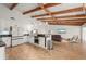 Open-concept kitchen featuring white cabinets, stainless appliances, and a large island at 5700 Oakview Ln, Punta Gorda, FL 33950
