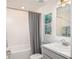 Clean bathroom with tub-shower combination and contemporary fixtures at 14037 Canada Goose Rd, Brooksville, FL 34614