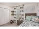 Themed bedroom with window, dinosaur accents, and ample closet space at 14037 Canada Goose Rd, Brooksville, FL 34614